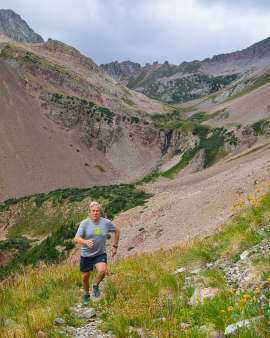 Sixty year old male trail running at 12,000 feet in the La Plata Mountains near Durango Colorado