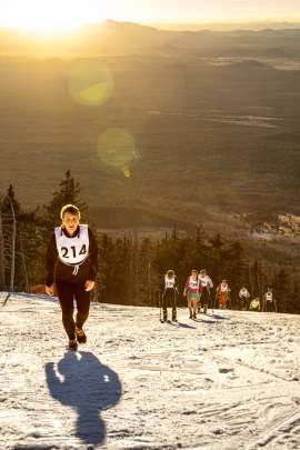 Runners and skiers pushing toward the top of the Arizona Snow Bowl ski area while competing the Kahtoola Uphill Race