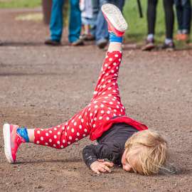 Child runner takes a face plant
